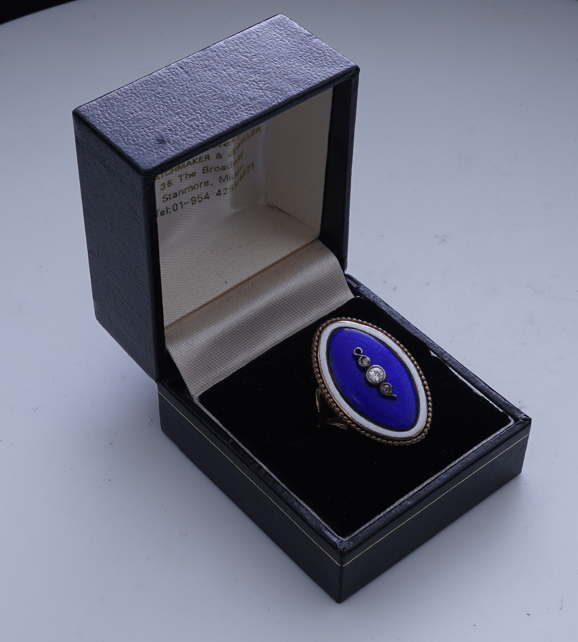 An enamel and diamond mourning ring, late 19th century